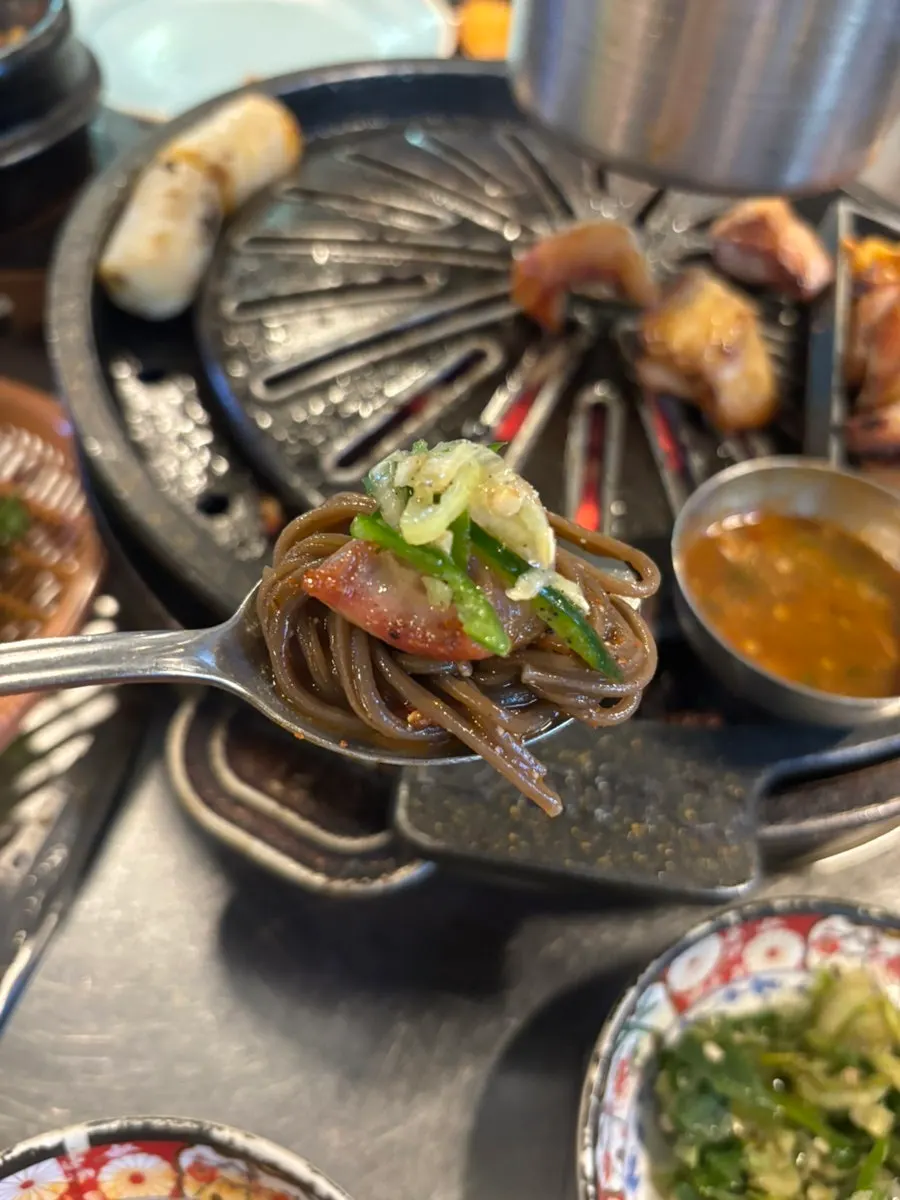 Lettuce wrap piled with meat and side dishes
