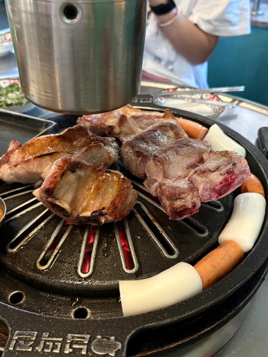 Golden-brown black pork raw ribs sprinkled with coarse salt