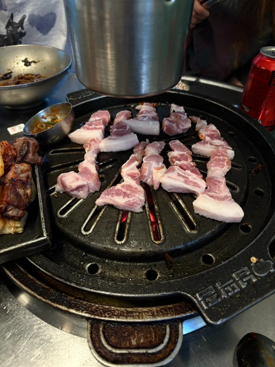 Extra order of kkodeulsal cooking on the grill