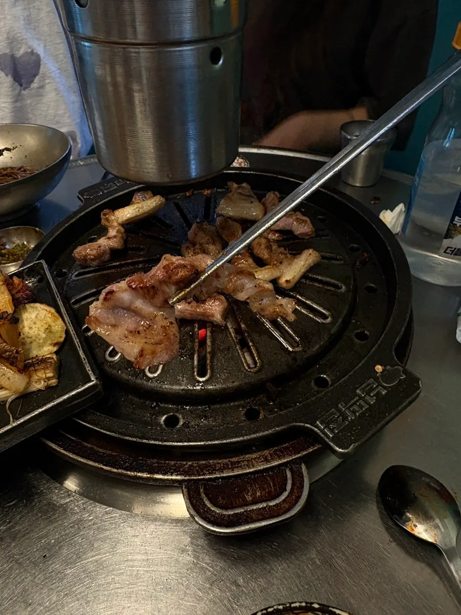Full table spread of meat and noodles