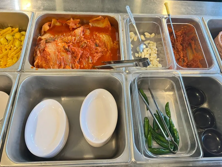 Variety of side dishes laid out at the self-serve bar