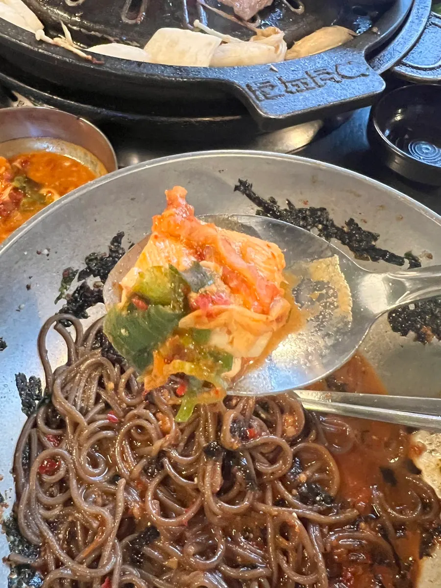 A bowl of perilla oil buckwheat noodles ready to mix