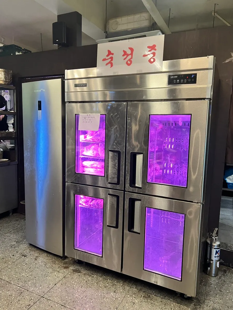 The meat aging fridge inside the restaurant