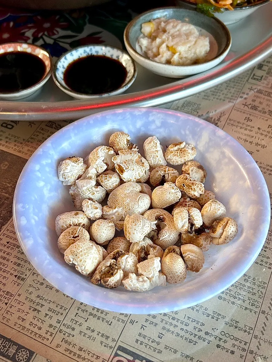 Retro newspaper table with the basic puffed corn snack