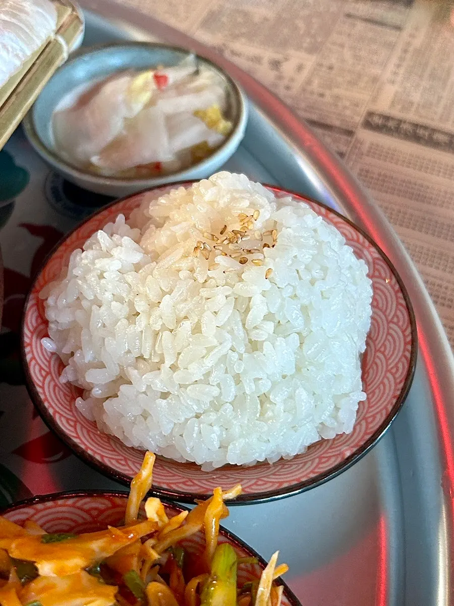 Vinegared rice, white kimchi, and wrap vegetables on the side
