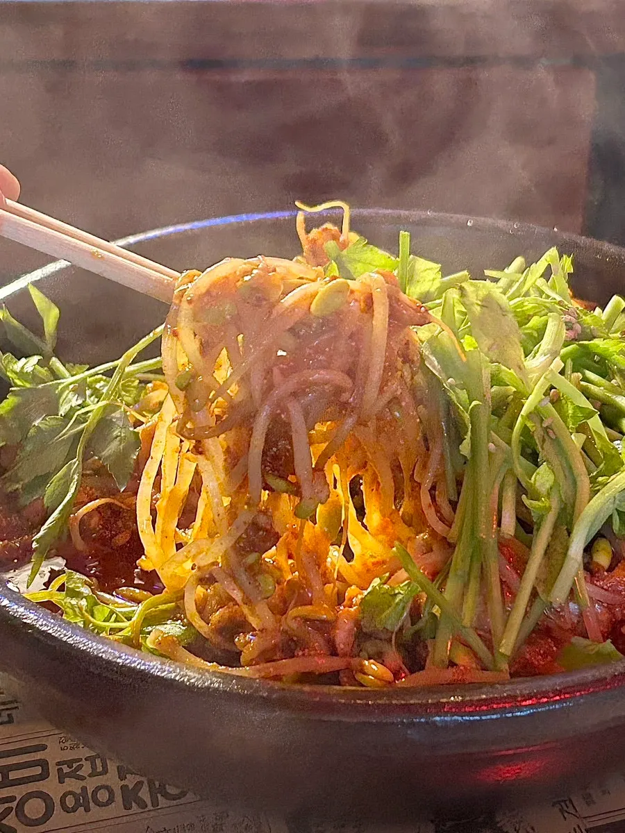 The egg-and-milt stew loaded with bean sprouts and minari