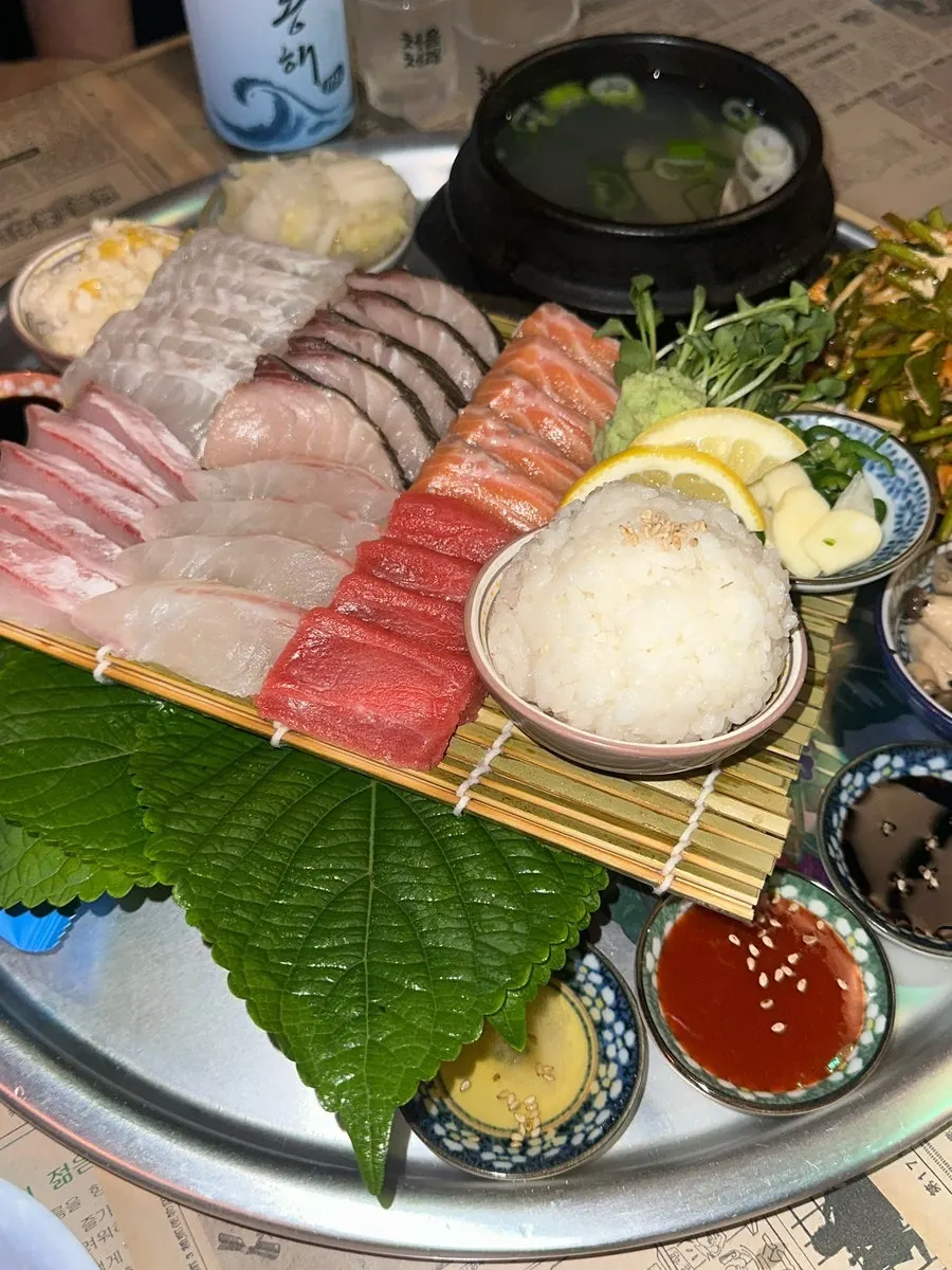 Aged sashimi set for two served across several plates