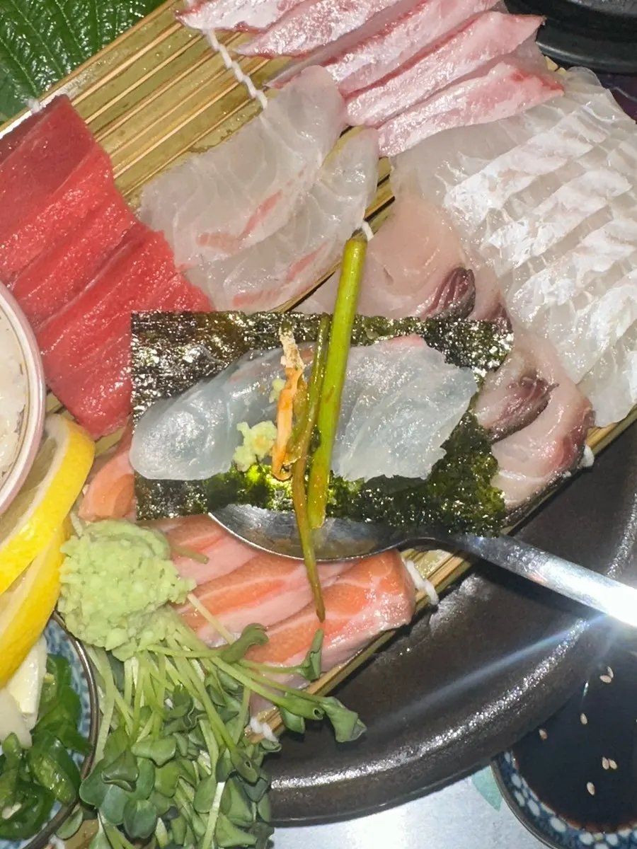 Plate of aged sashimi with salmon, red seabream, and flounder