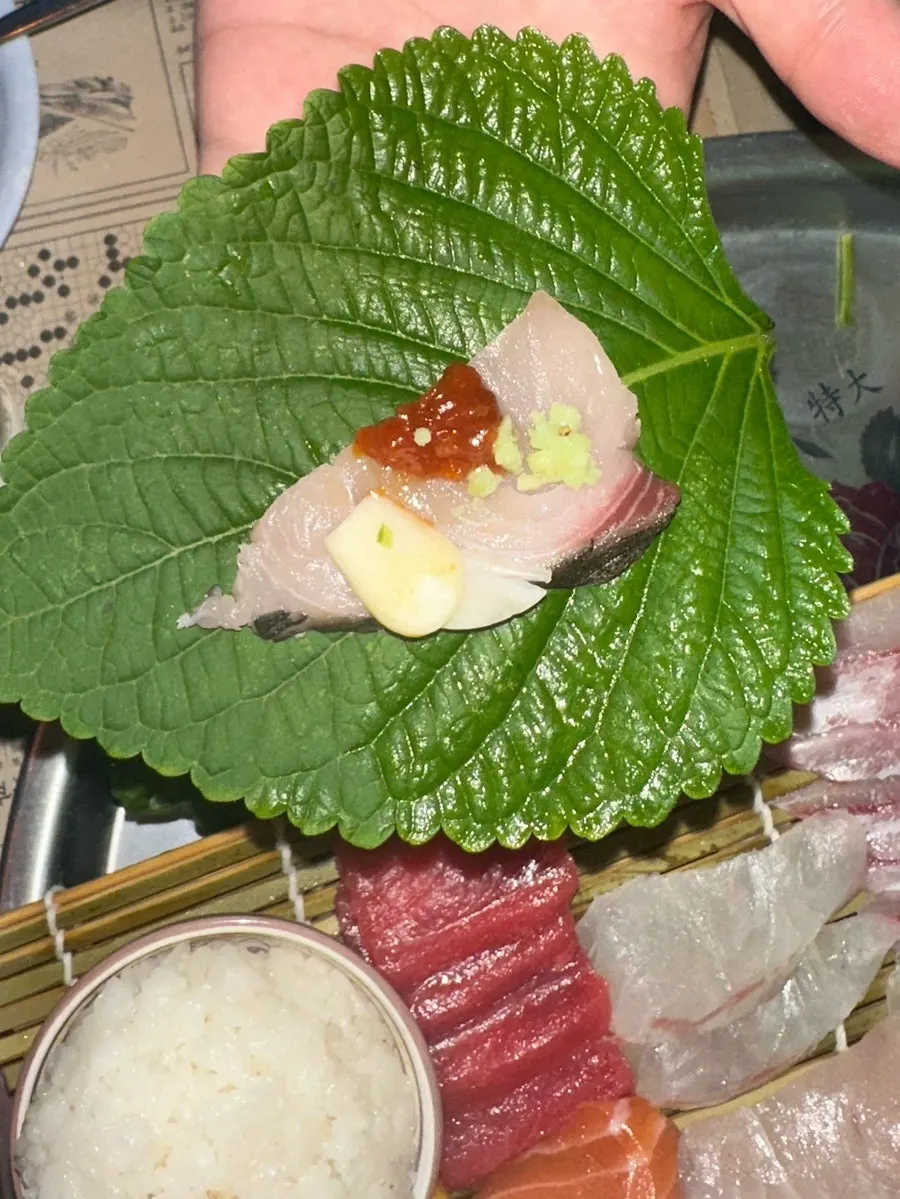 Aged sashimi wrapped in perilla leaf