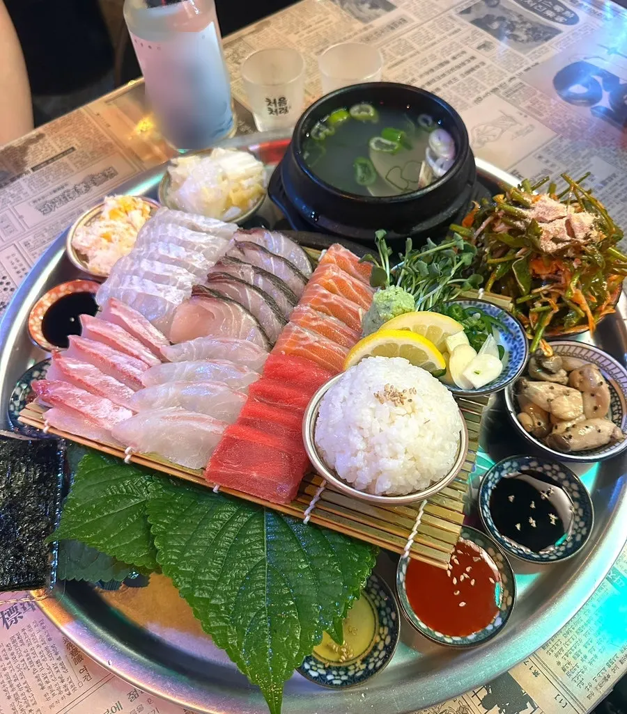 Aged sashimi set served alongside soju