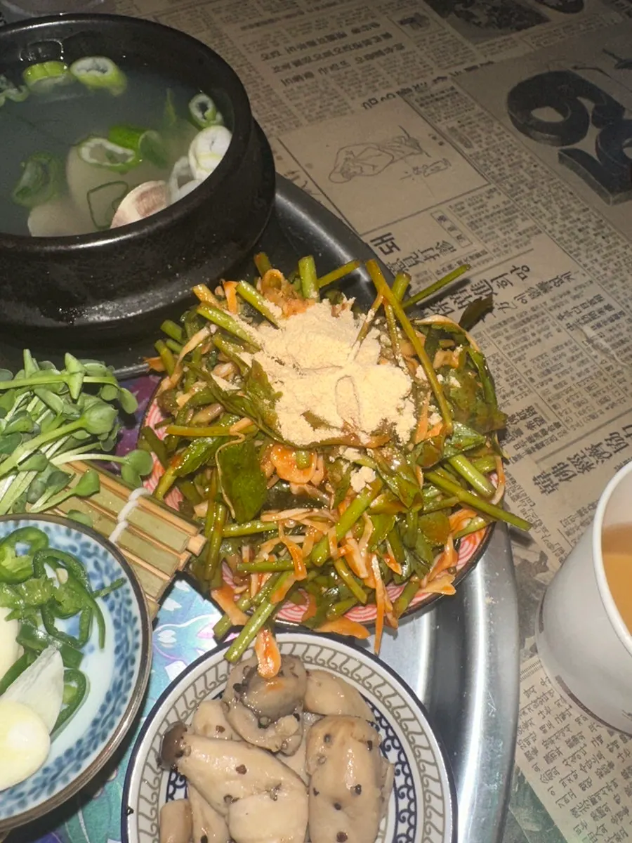 Warm mini clam soup served on the side