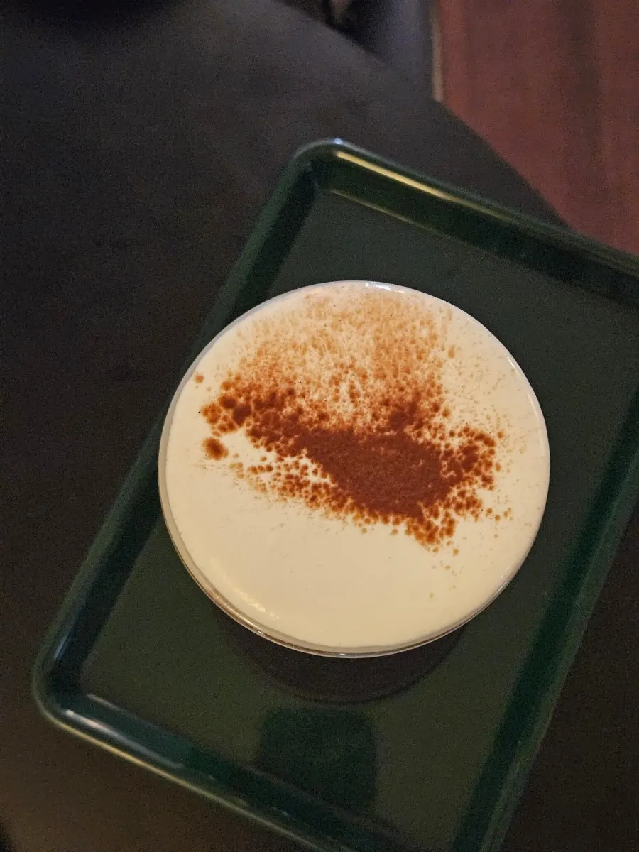 A glass of Nerdy Cream Mocha topped with cream