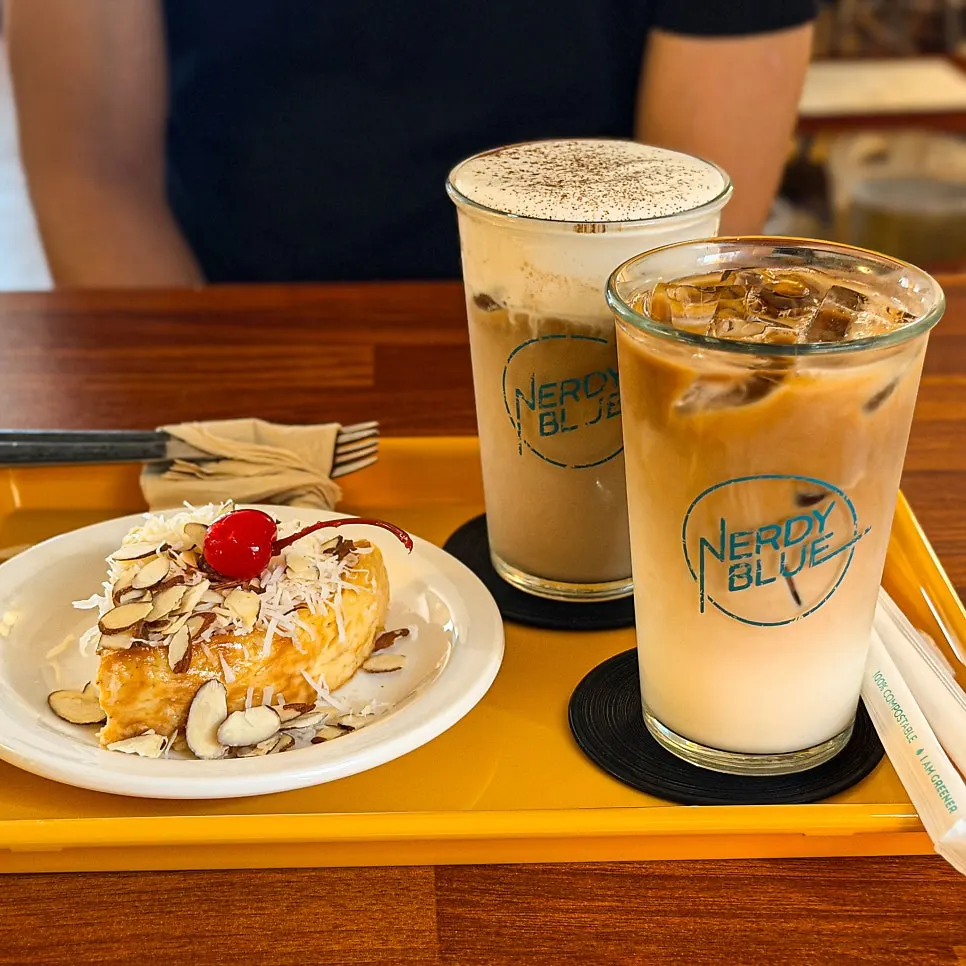 A glass of Nerdy Blue Burrow's cold brew latte