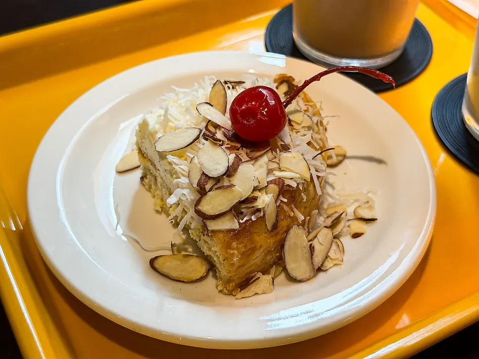 A cheesecake slice split in half to share