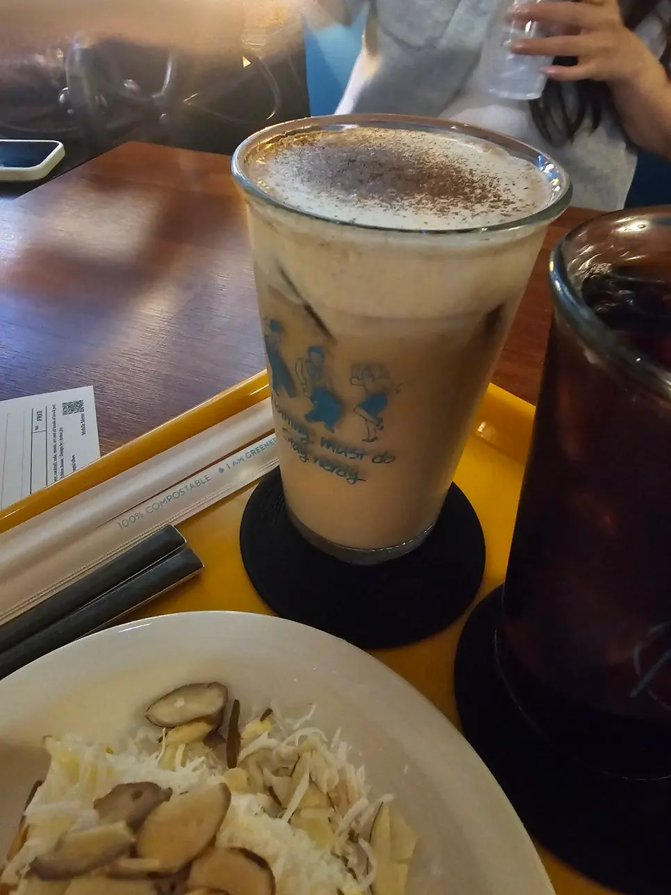 A coffee cup on a table under soft lighting