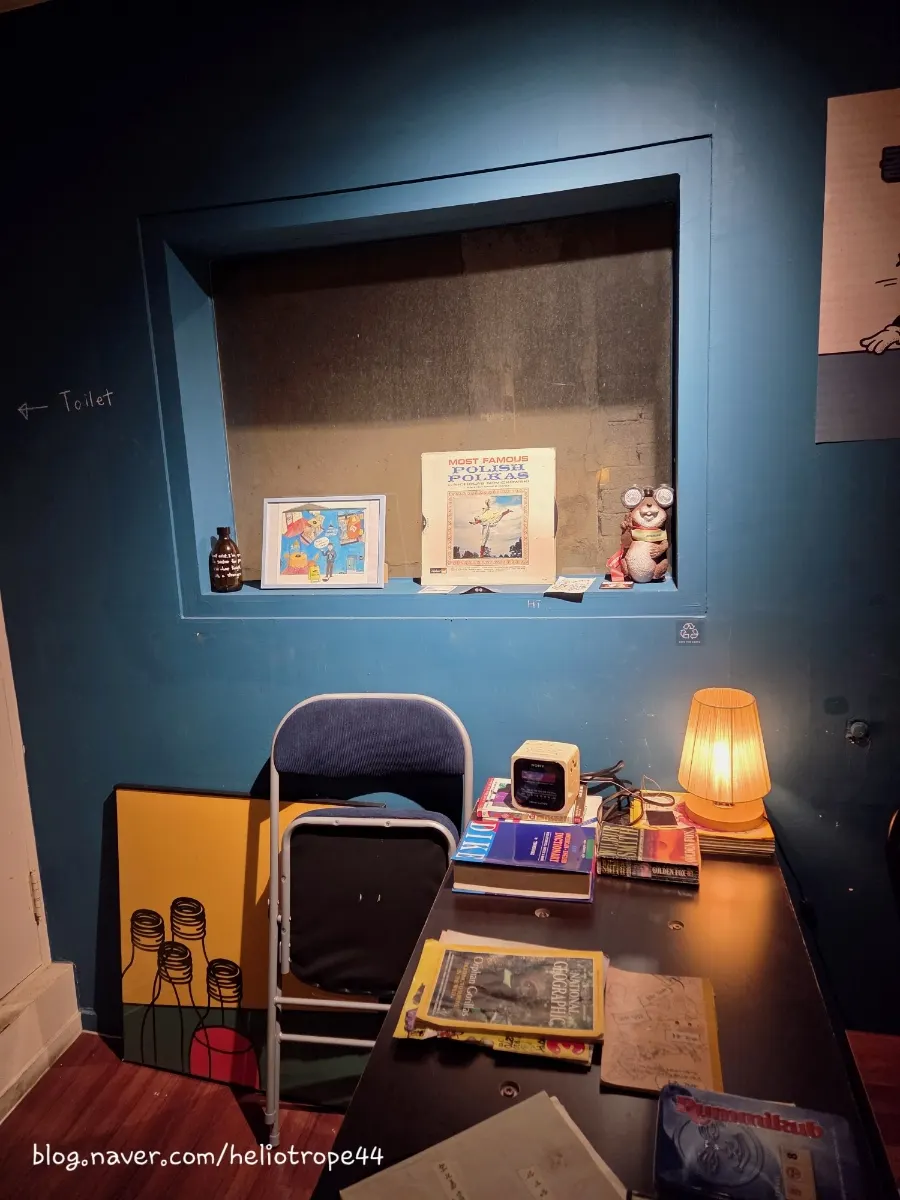 Table by the window with a light fixture