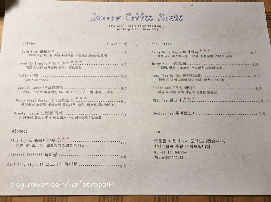 Menu board listing cold brew and hand-drip coffee