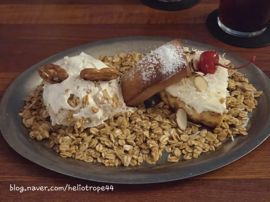Dessert plate with cheesecake, banana pudding, financier, and granola