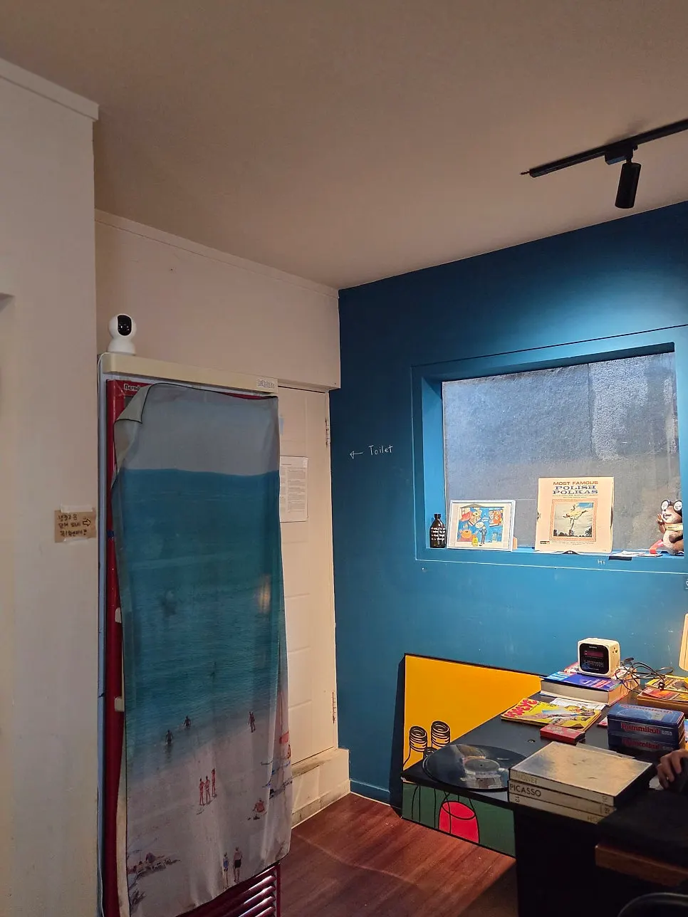 Doodles and props on the Nerdy Blue Burrow wall