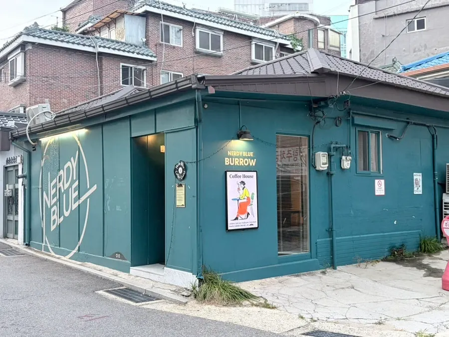 Exterior view of Nerdy Blue Burrow cafe in Wangsimni