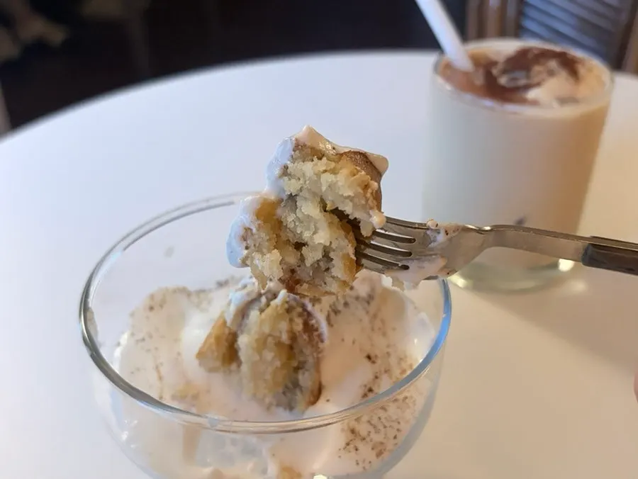 Close-up of banana pudding topped with cream