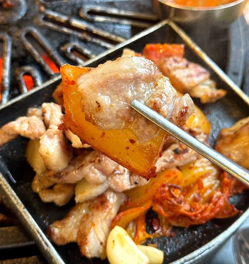 Kimchi grilling in pork belly fat