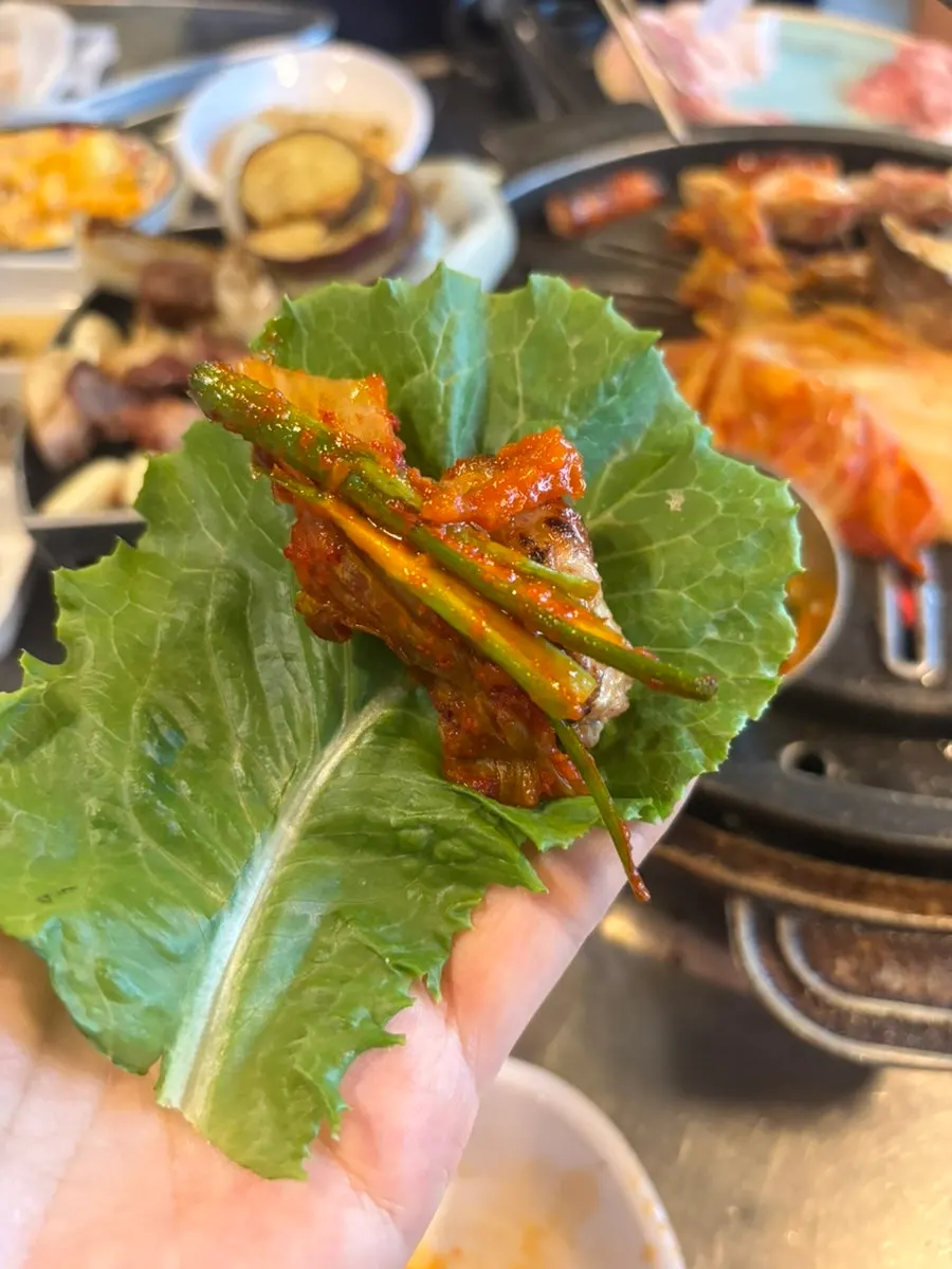 Spread of meat and side dishes at Neopttakjip Samsong Branch