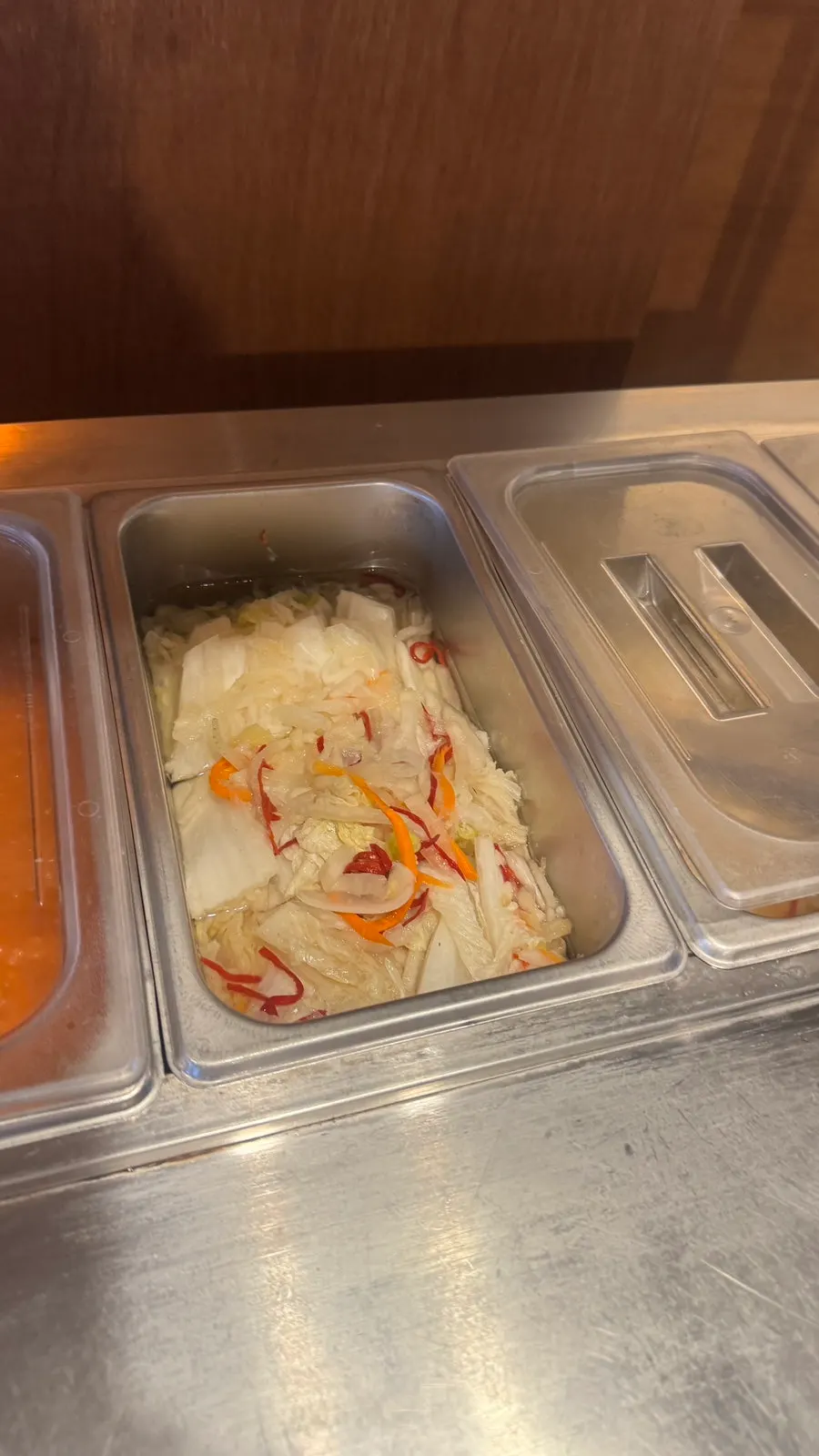 A plate of side dishes brought from the self-serve bar