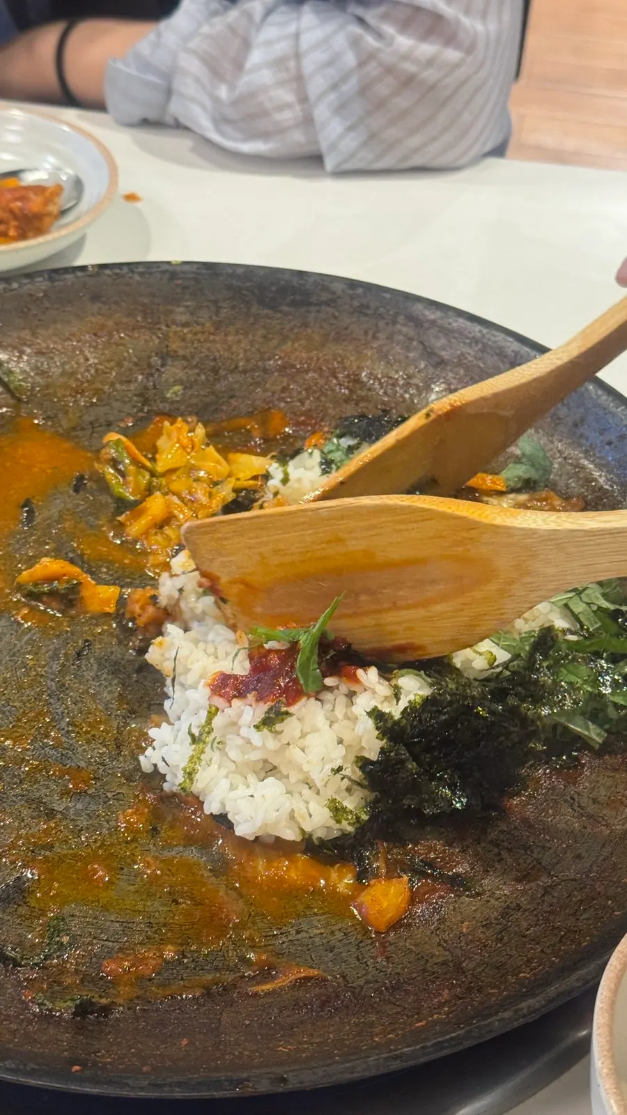 Picking up a piece of dakgalbi