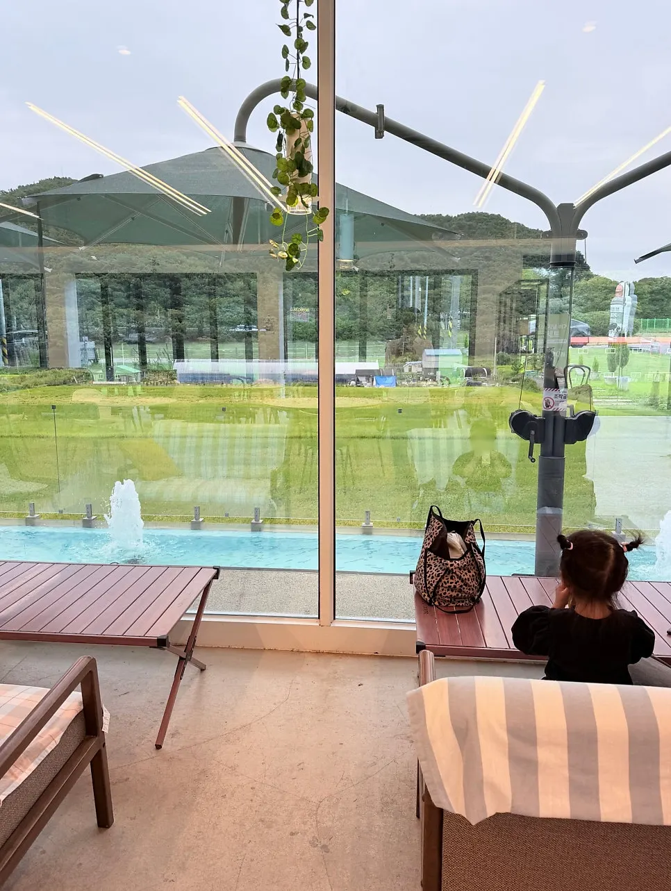 Seats facing the rice-field view through the window at Nillai
