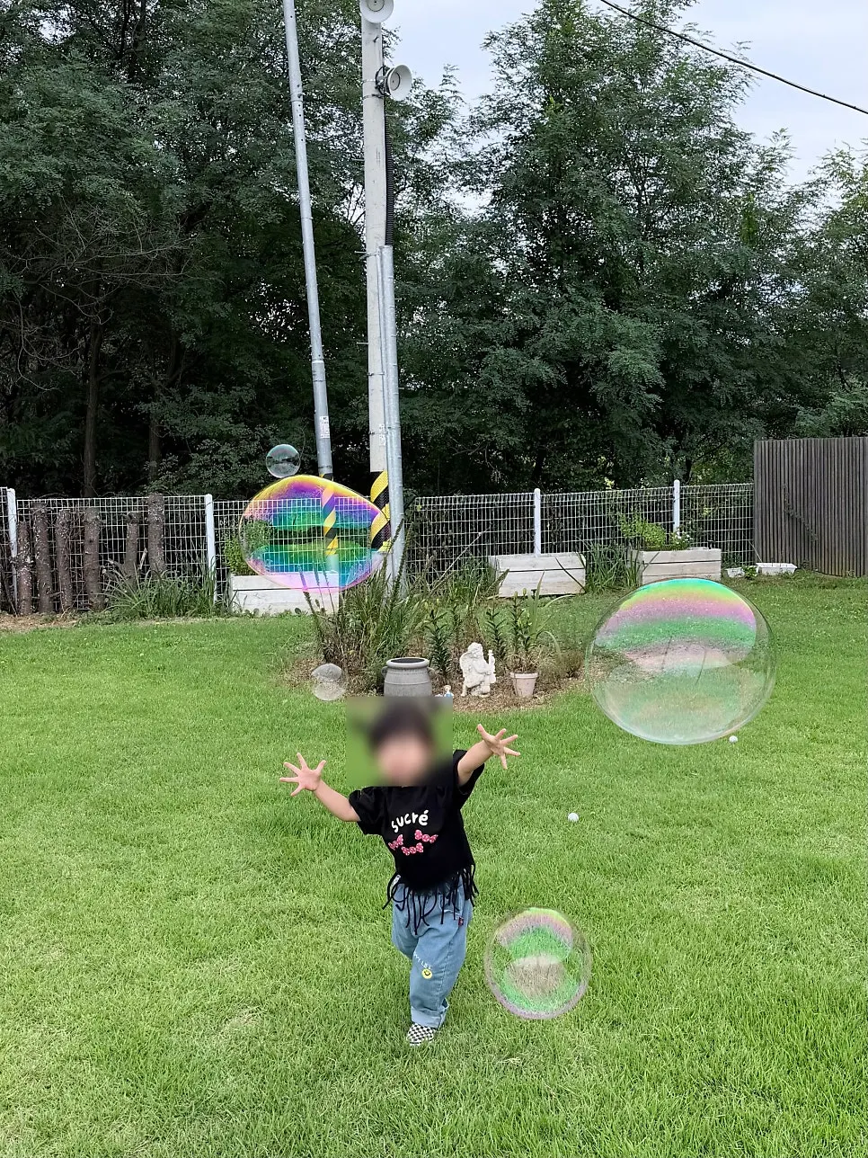 Playing with bubbles in Nillai's garden