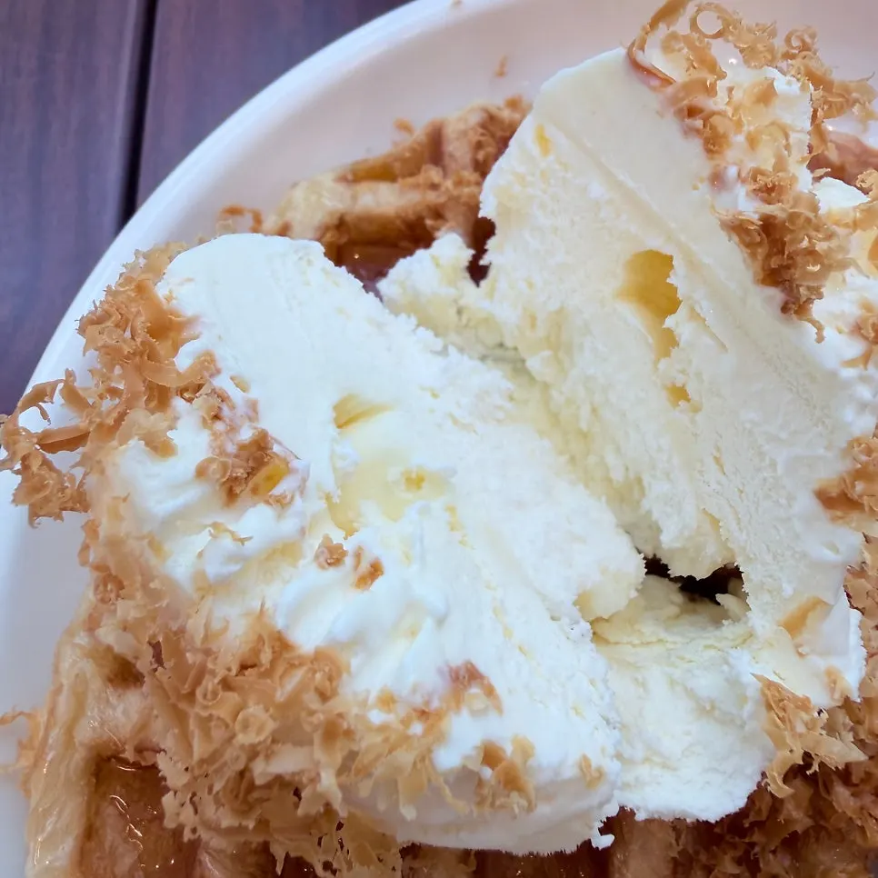 Croffle topped with cheese and vanilla ice cream
