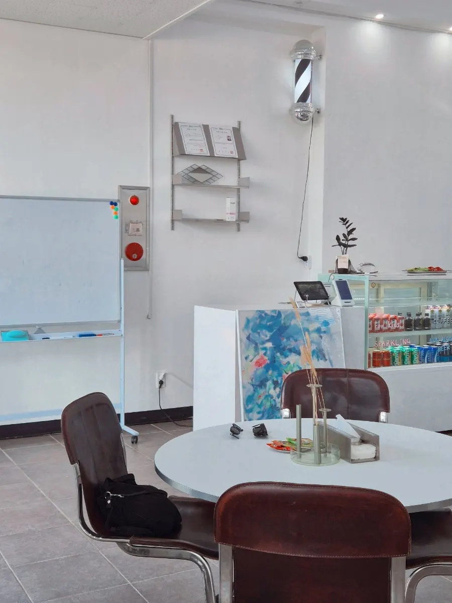 White-toned interior of Noah Barbershop Jeju