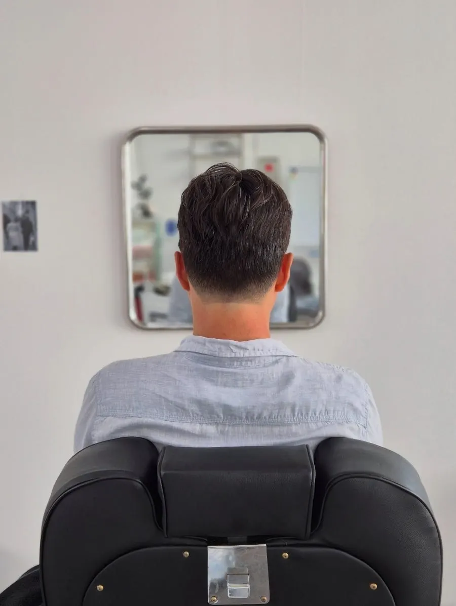 Men's hairstyle finished with cut and perm