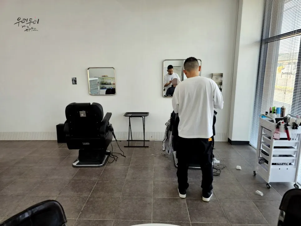 Simple one-man salon interior with two styling chairs