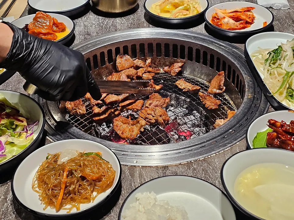 Dinner table with marinated ribs and side dishes laid out