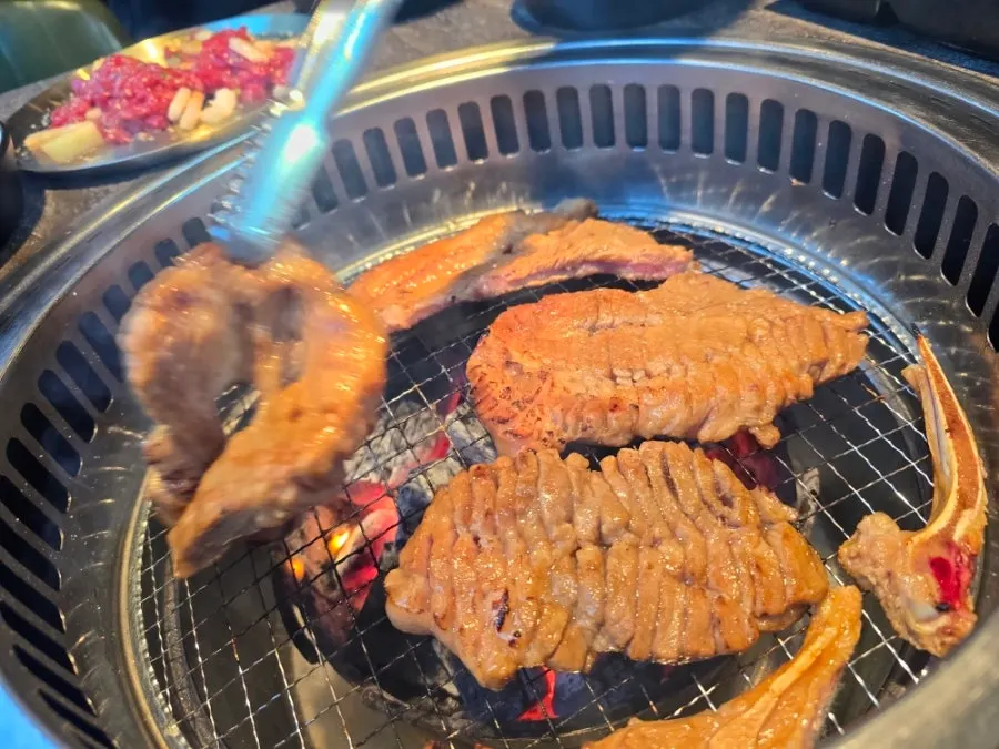 Pork yangnyeom galbi browning nicely over charcoal