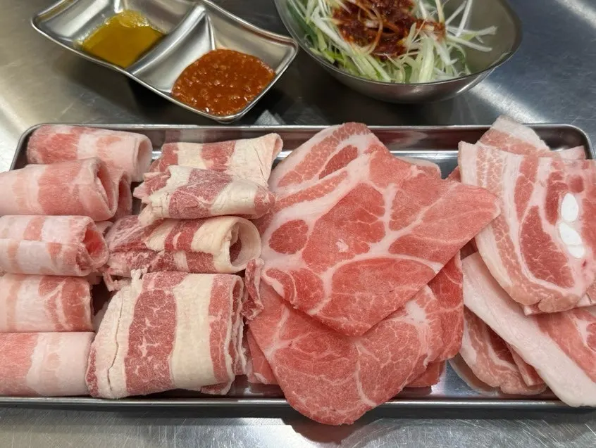 House-made gochujang-marinated pork belly