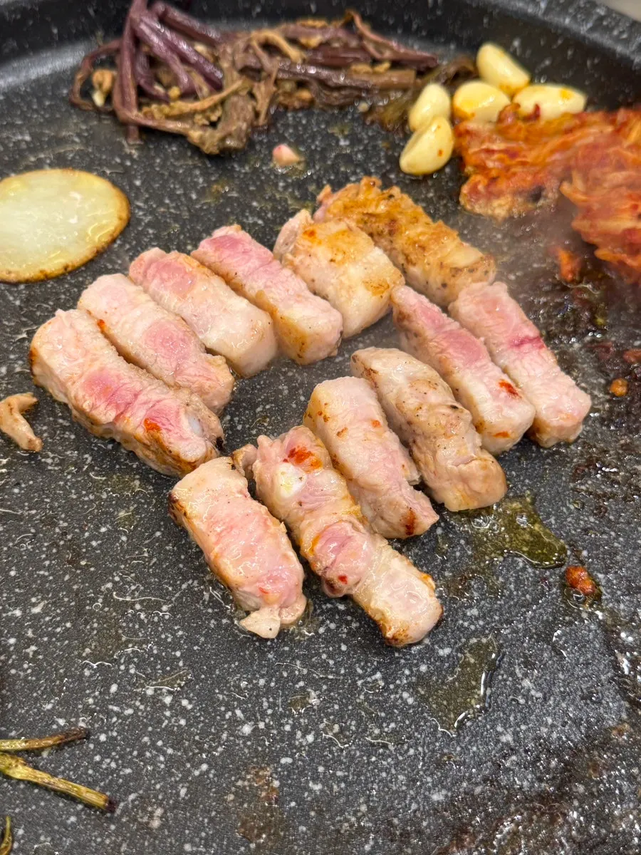 Thick-cut Korean pork belly on the grill