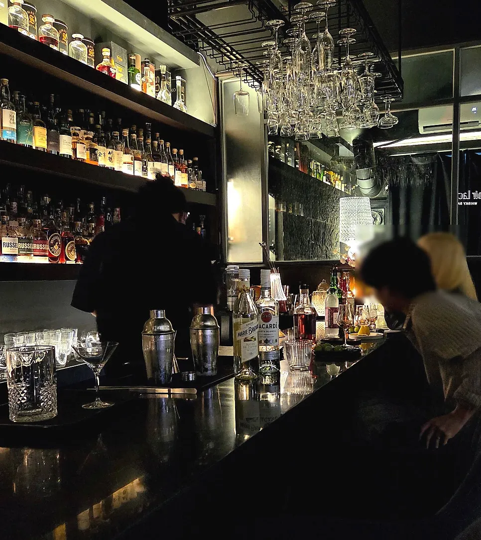Back bar lined with whiskey bottles