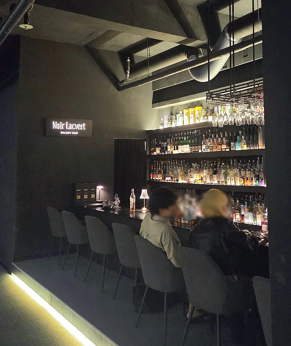 Lighting and interior of the classic bar Noir Lacquer Verre