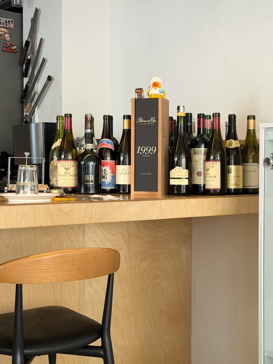 Wine and wine glasses displayed at Noju