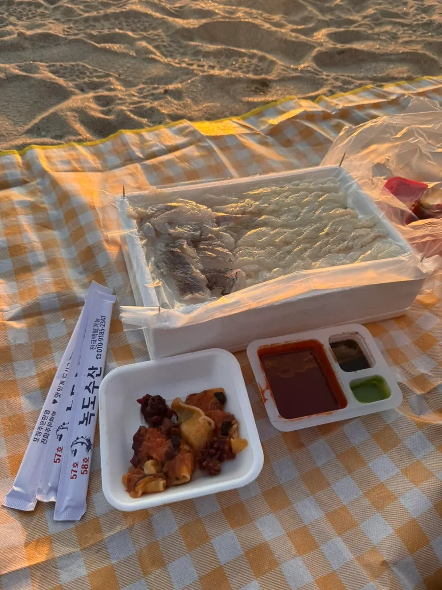 Arriving at Daecheon Beach with the packed sashimi