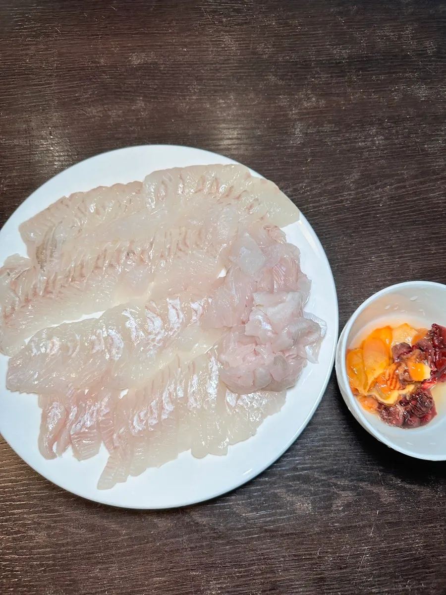 Close-up of glossy white flounder sashimi