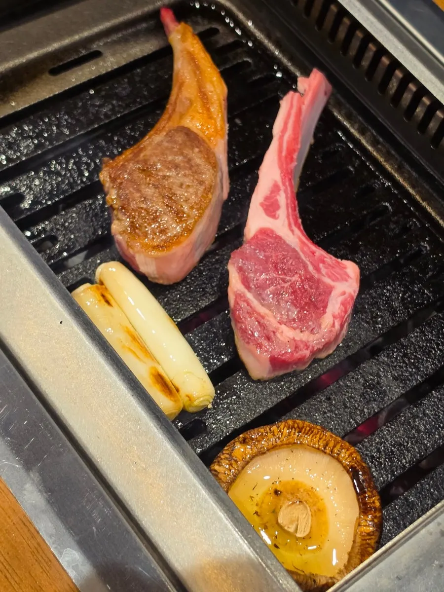 Lamb chops grilled while checking doneness