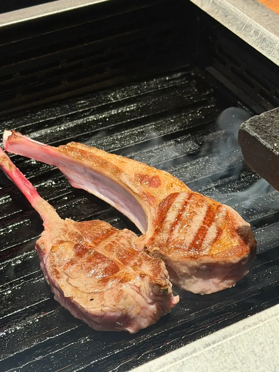 Shoulder rack and French rack being grilled