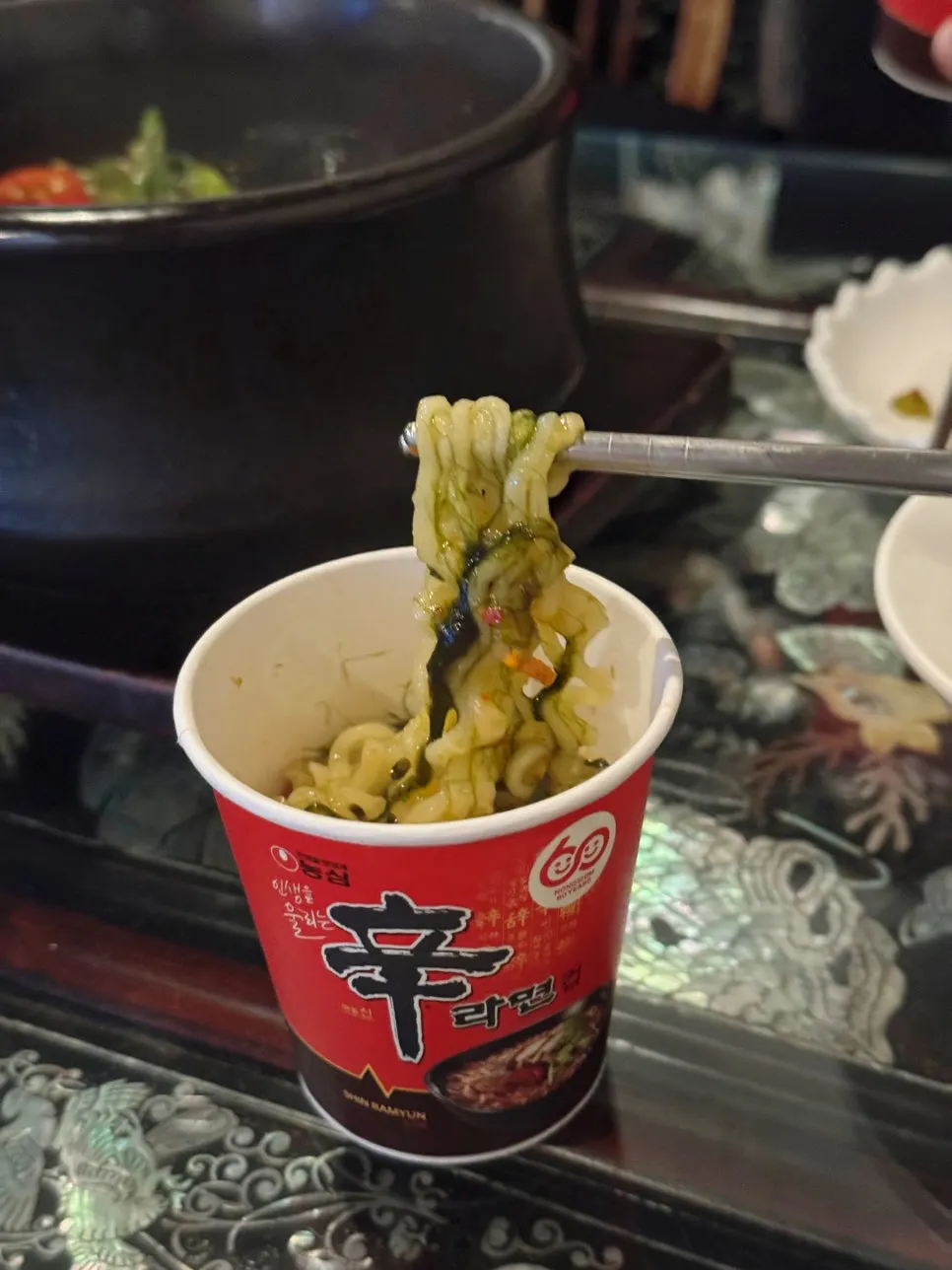 Ramyeon served in a Shin Ramyeon paper cup