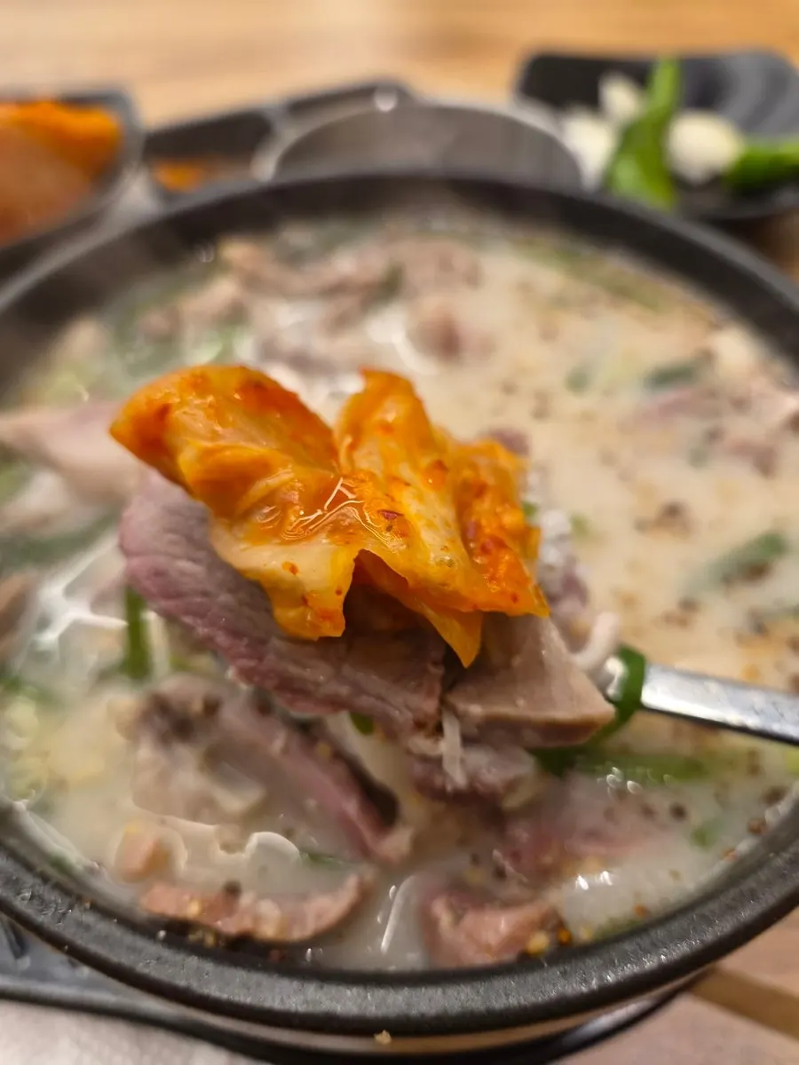 Full table setting of gukbap eaten with rice