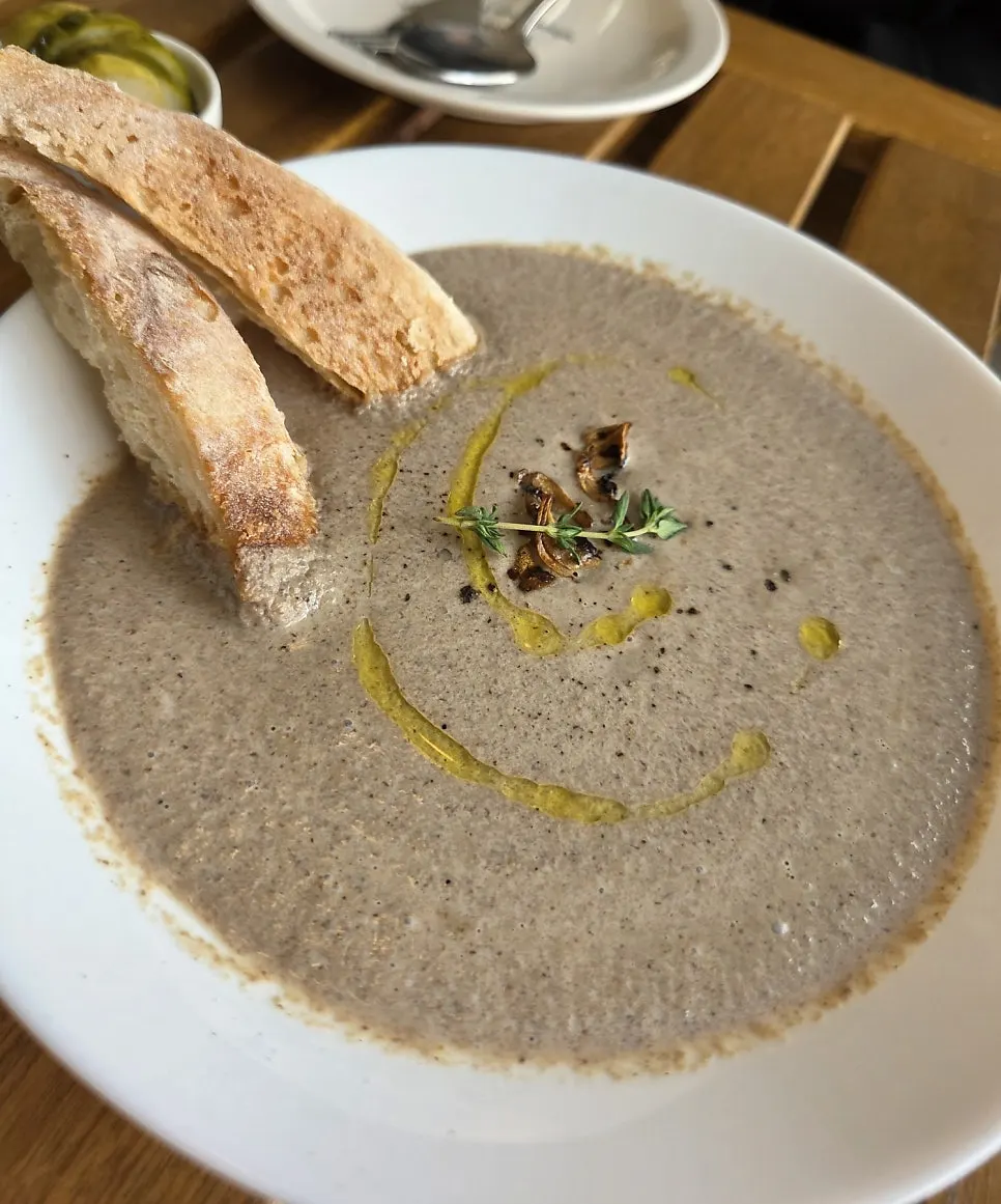 Mushroom soup with baguette table setting