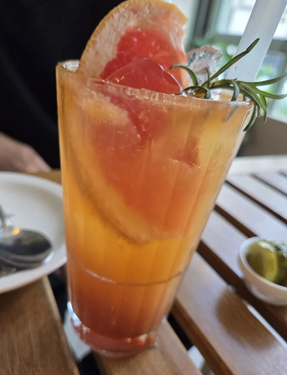 A glass of colorful grapefruit ade